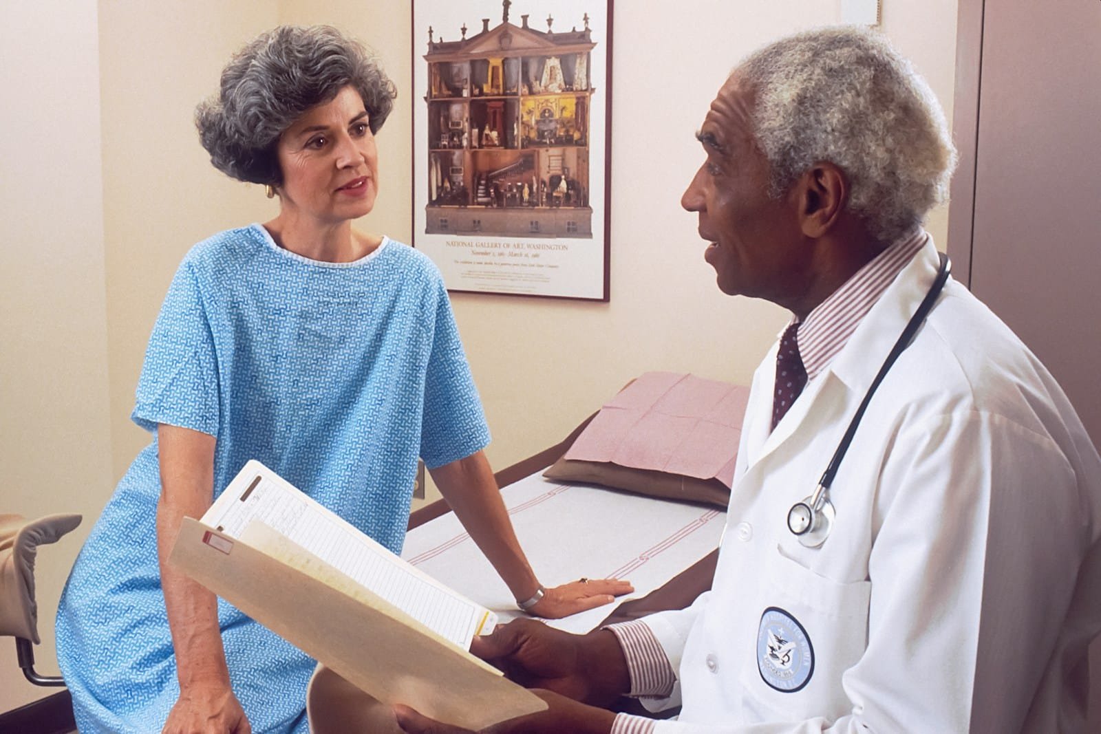 Photo by National Cancer Institute man in blue crew neck t-shirt holding white printer paper
